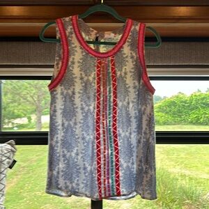 NWOT(never worn) women’s sleeveless blouse by THML size Large 100 percent rayon